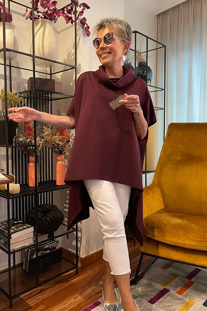 Top tipo poncho de bajo asimétrico con picos en los laterales